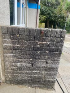 before pressure washed school brickwork