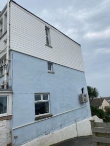 render wall cleaning and graffiti removal service after